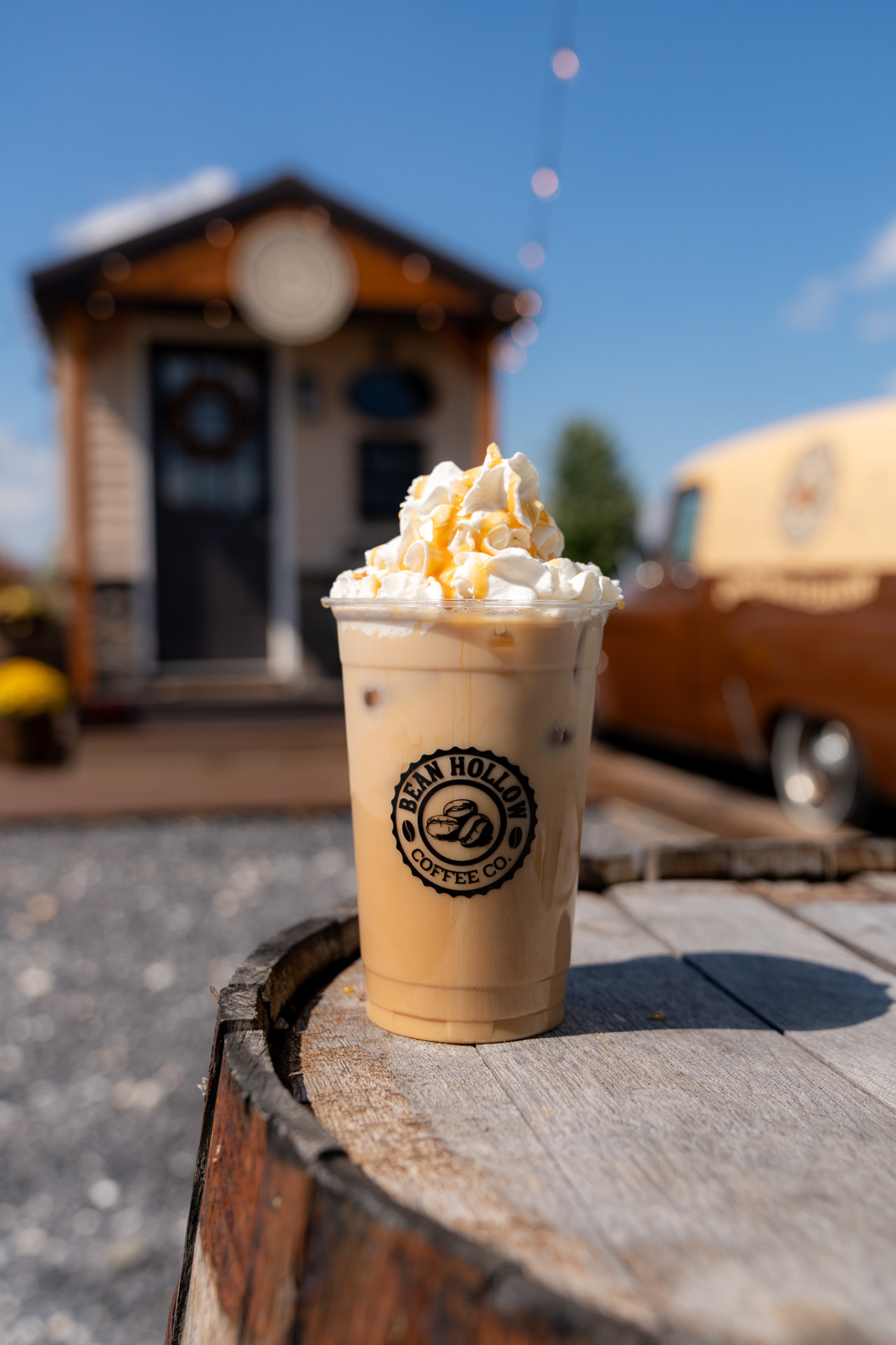 Iced caramel latte on a barrel