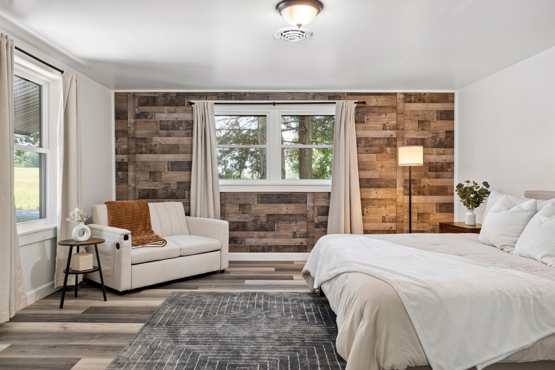 Bedroom with reclaimed wood accent wall