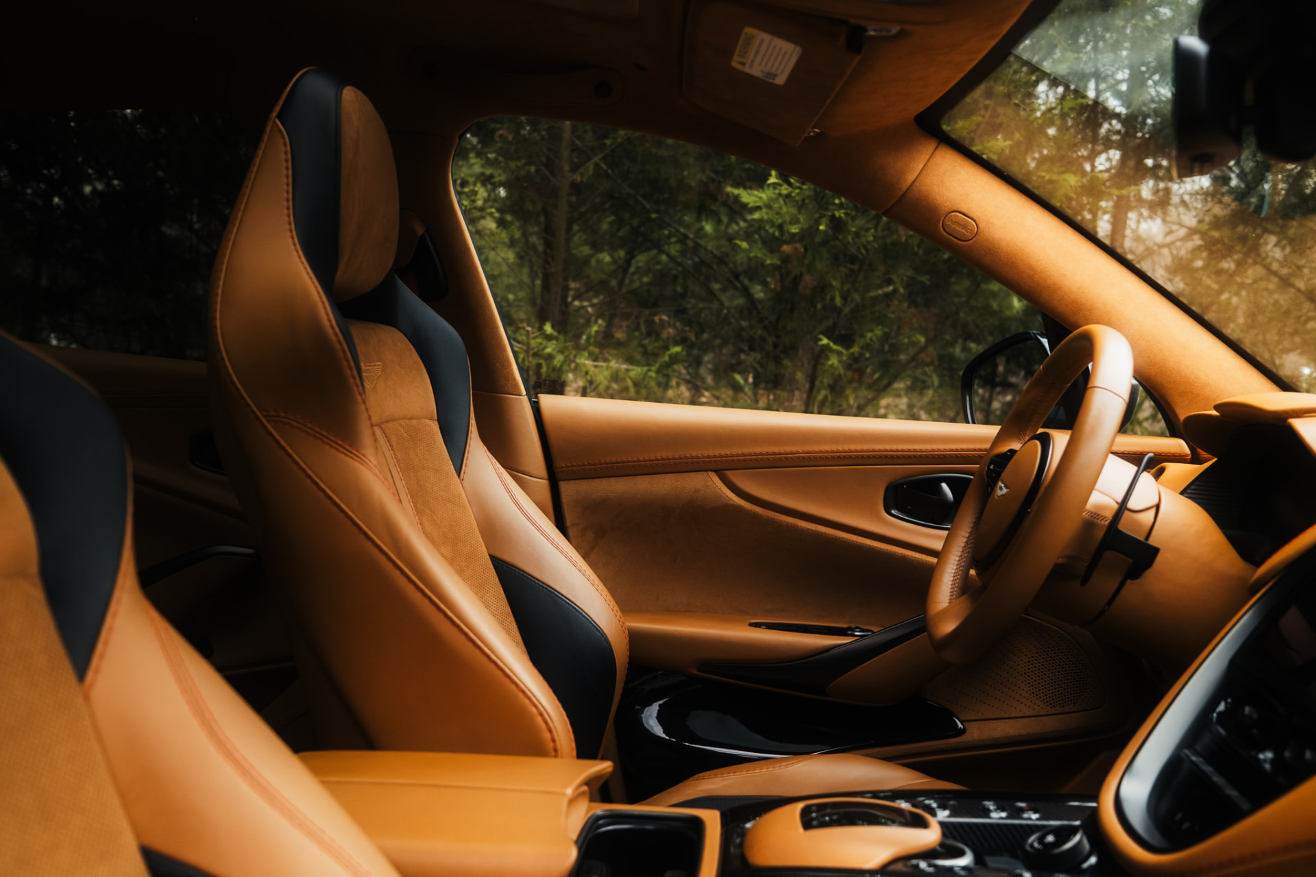 Tan leather Aston Martin interior with stitched seats