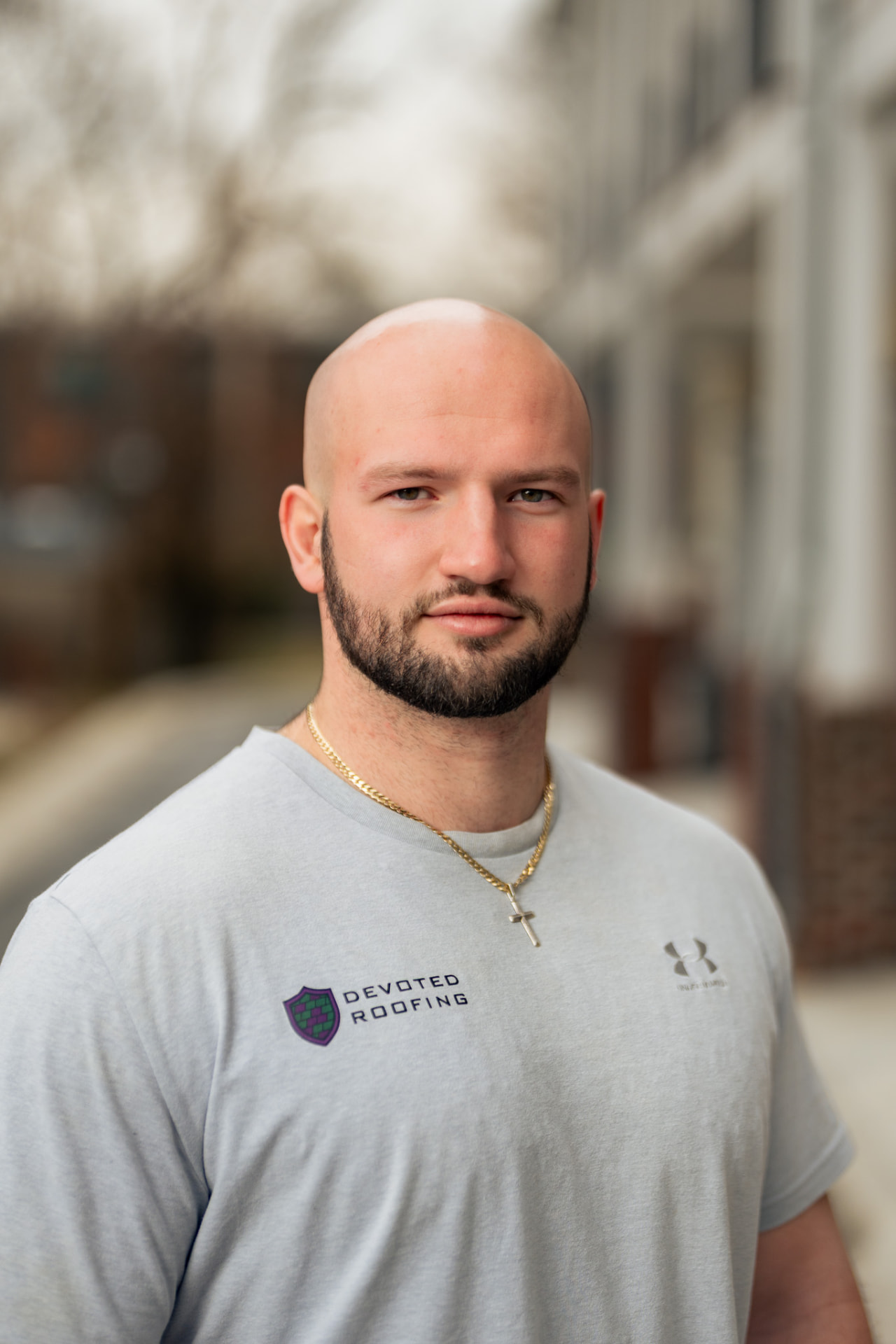 Outdoor branded headshot for a roofing company